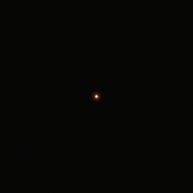 A bright white disc 4 px across on a dark background on Super 35 4-perf: the red-orange halo reaches about 11 px beyond the disc.