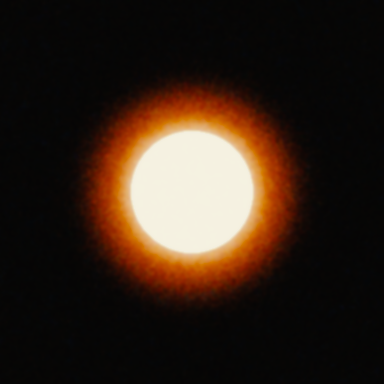 A bright white disc 120 px across on a dark background on Super 8: the red-orange halo reaches about 64 px beyond the disc.