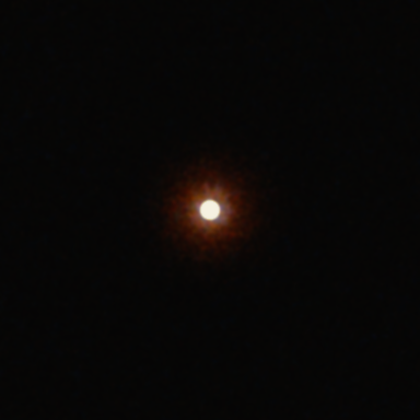 A bright white disc 16 px across on a dark background on Super 8: the red-orange halo reaches about 49 px beyond the disc.