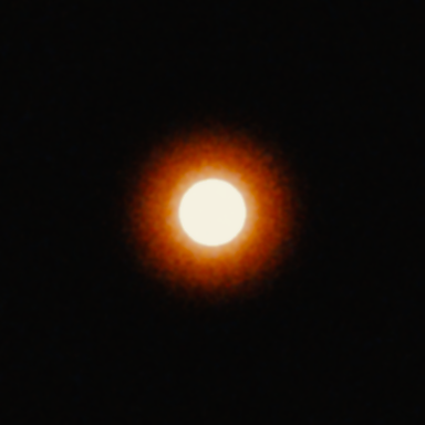 A bright white disc 58 px across on a dark background on Super 8: the red-orange halo reaches about 62 px beyond the disc.